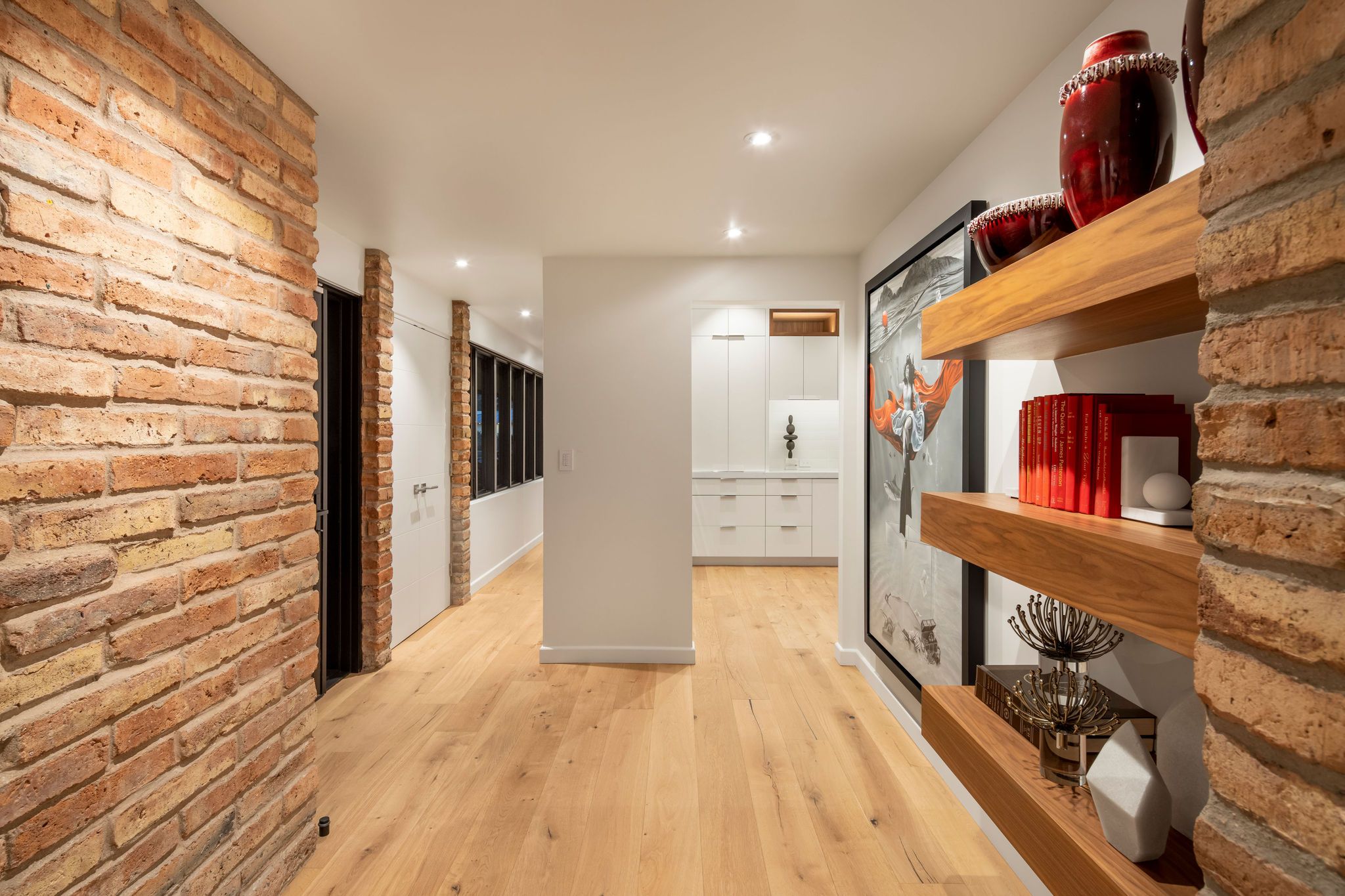 Interior of a Moss Custom Homes residence with stone detailing and warm timber finishes