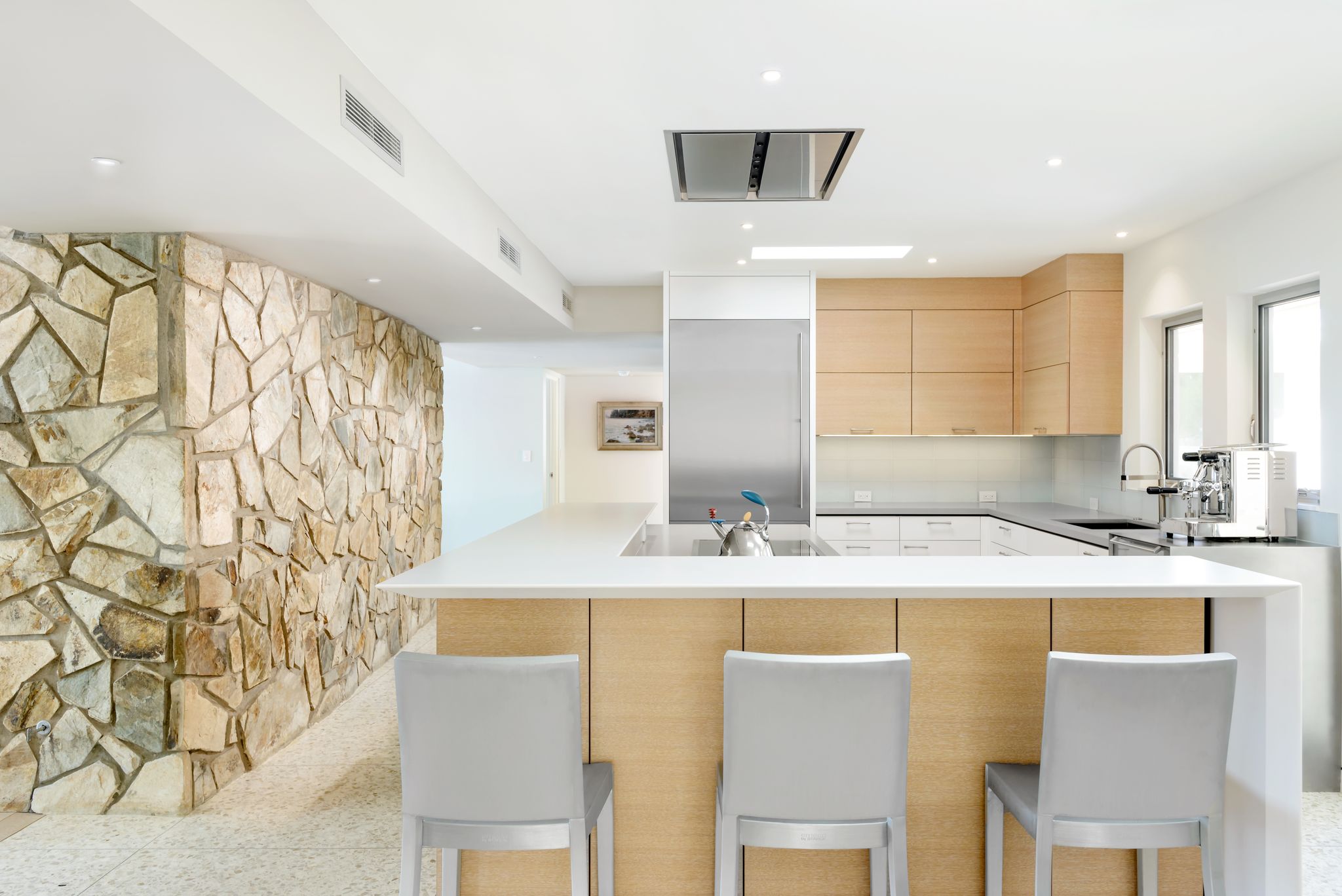 Renovated kitchen with stone island and custom cabinetry in Paradise Valley